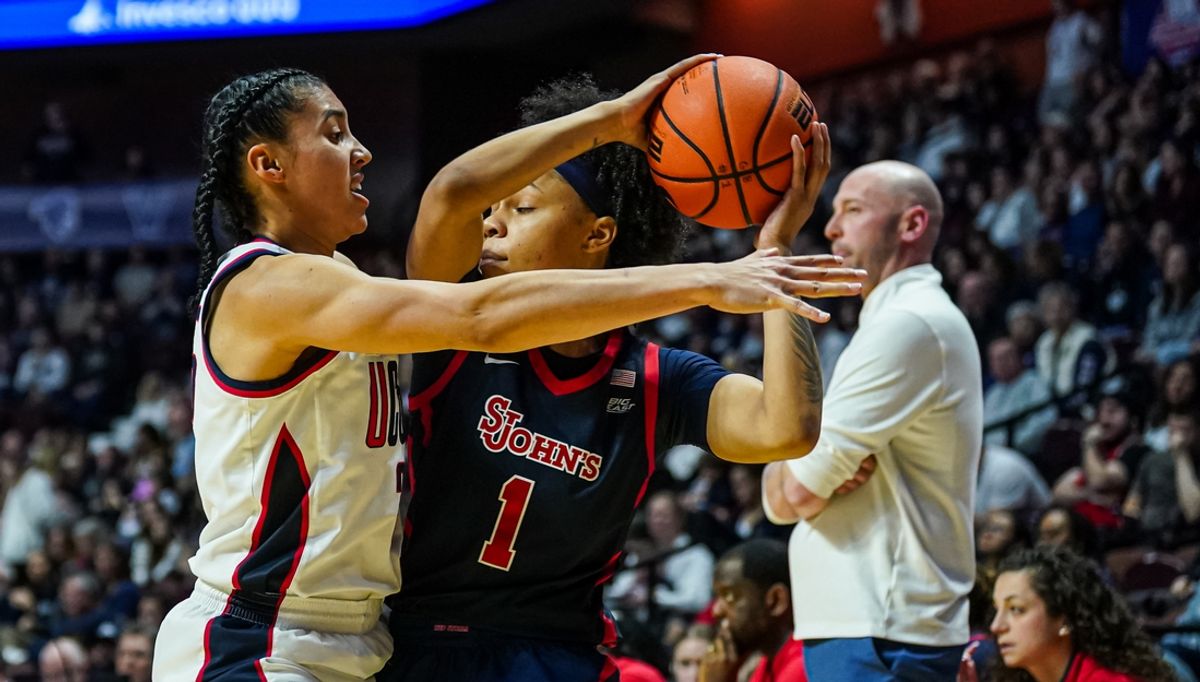 Mar 8, 2025; Uncasville, CT, USA; UConn Huskies guard Azzi Fudd (35) defends against St. John's Red Storm guard Ariana Vanderhoop (1) in the first half at Mohegan Sun Arena. Mandatory Credit: David Butler II-Imagn Images