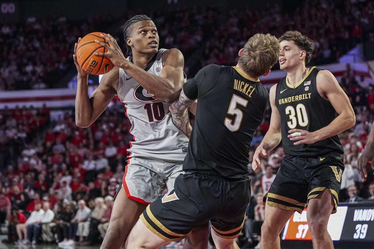 Mar 8, 2025; Athens, Georgia, USA; Georgia Bulldogs forward RJ Godfrey (10) is called for an offensive foul after running into Vanderbilt Commodores guard Tyler Nickel (5) during the first half at Stegeman Coliseum. Mandatory Credit: Dale Zanine-Imagn Images
