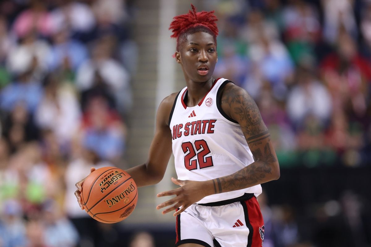 Mar 8, 2025; Greensboro, NC, USA; NC State Wolfpack guard Saniya Rivers (22) brings the ball up court during the fourth quarter against North Carolina Tar Heels at First Horizon Coliseum. Mandatory Credit: Cory Knowlton-Imagn Images