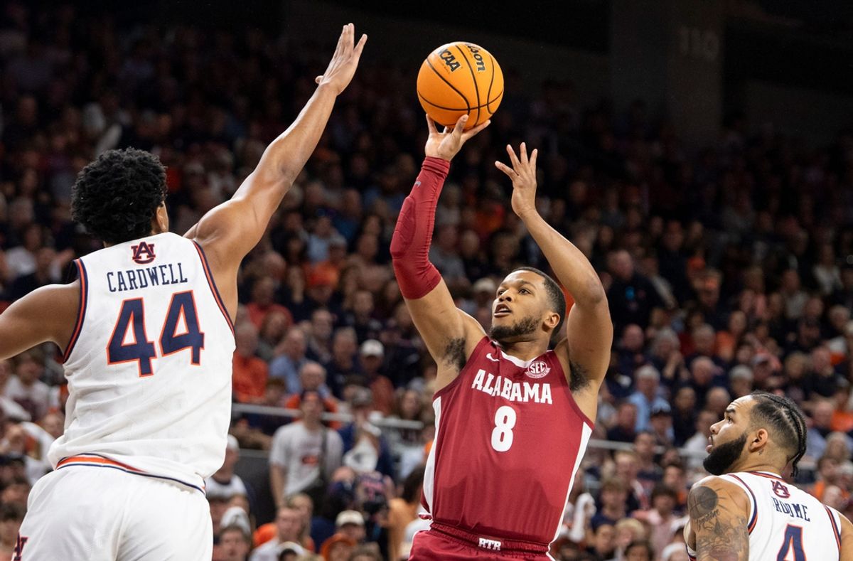 Alabama Crimson Tide guard Chris Youngblood (8) takes a jump shot as Auburn Tigers take on Alabama Crimson Tide at Neville Arena in Auburn, Ala., on Saturday, March 8, 2025.