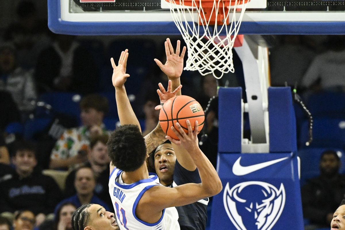 Mar 8, 2025; Chicago, Illinois, USA; Georgetown Hoyas forward Drew McKenna (7) defends against DePaul Blue Demons guard CJ Gunn (11) during the first half at Wintrust Arena. Mandatory Credit: Matt Marton-Imagn Images