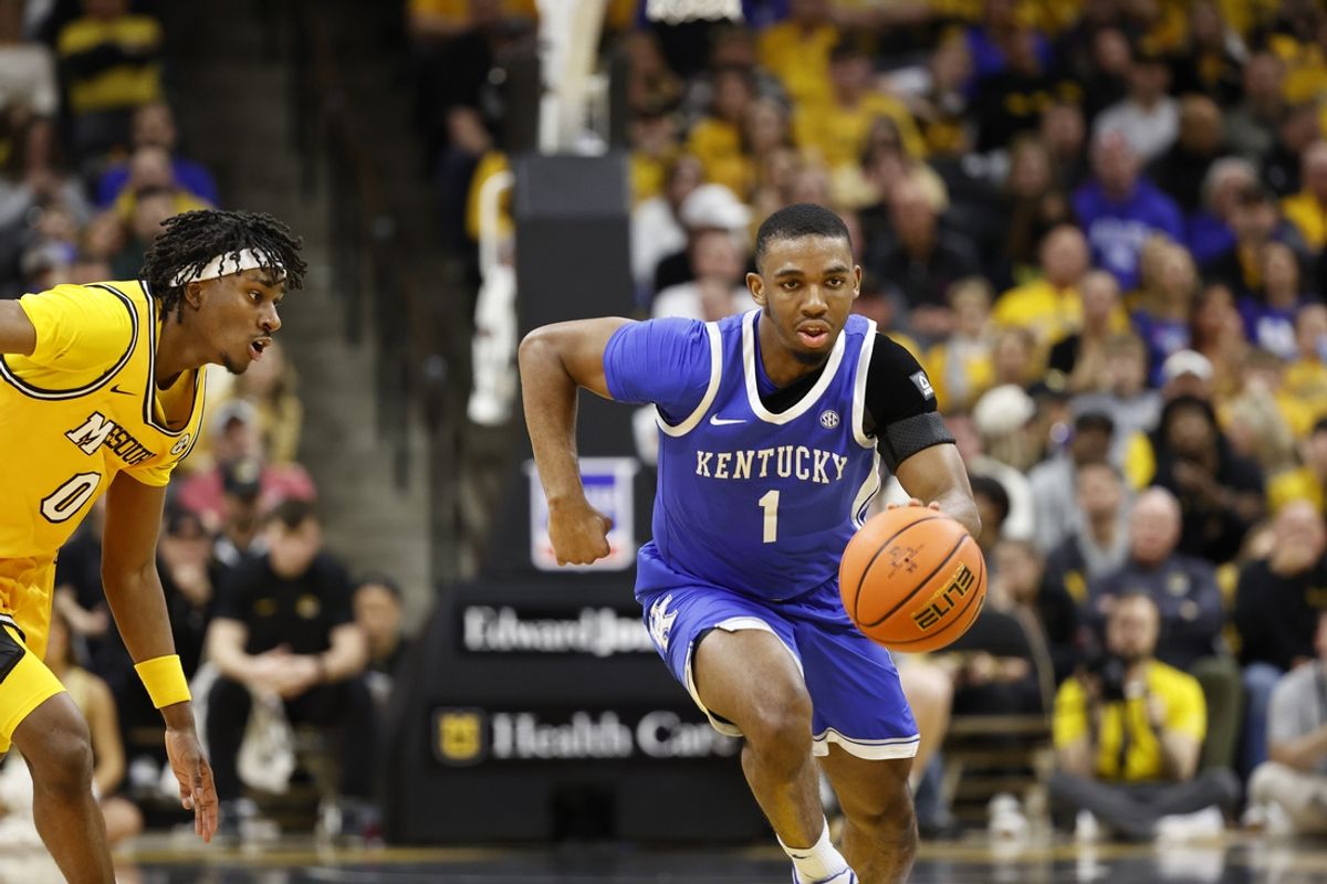 Mar 8, 2025; Columbia, Missouri, USA; Kentucky Wildcats guard Lamont Butler (1) dribbles past Missouri Tigers guard Anthony Robinson II (0) in the second half at Mizzou Arena. Mandatory Credit: Gary Rohman-Imagn Images