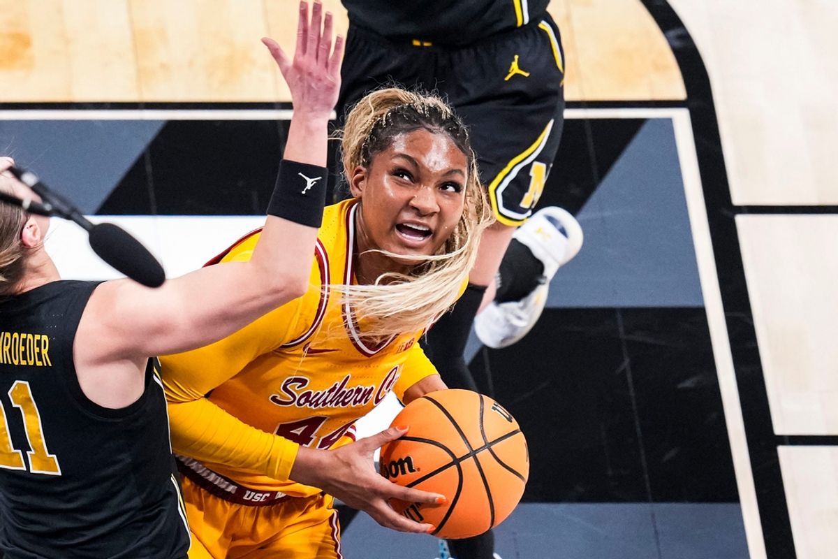 USC Trojans forward Kiki Iriafen (44) looks toward the basket for a shot against Michigan Wolverines guard Greta Kampschroeder (11) Saturday, March 8, 2025, in a semifinals game at the 2025 TIAA Big Ten Women's Basketball Tournament between the Iowa Hawkeyes and the Ohio State Buckeyes at Gainbridge Fieldhouse in Indianapolis.