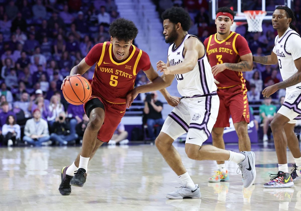 Mar 8, 2025; Manhattan, Kansas, USA; Iowa State Cyclones guard Curtis Jones (5) is guarded by Kansas State Wildcats guard David Castillo (10) during the second half at Bramlage Coliseum. Mandatory Credit: Scott Sewell-Imagn Images