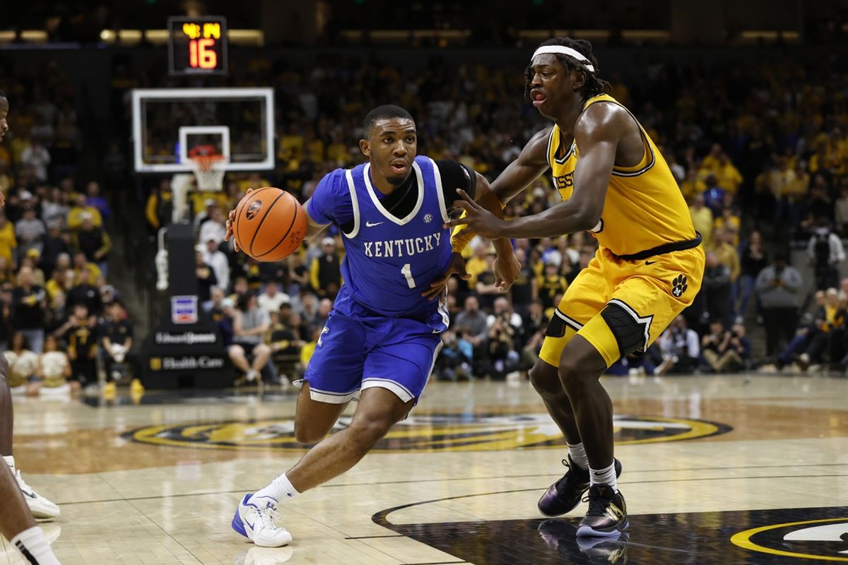 Mar 8, 2025; Columbia, Missouri, USA; Kentucky Wildcats guard Lamont Butler (1) drives past Missouri Tigers guard Mark Mitchell (25) in the second half at Mizzou Arena. Mandatory Credit: Gary Rohman-Imagn Images
