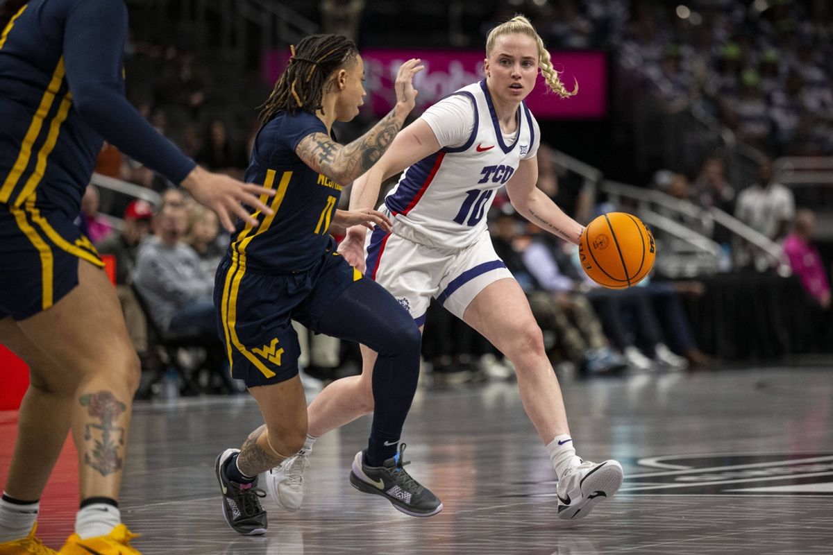 Mar 8, 2025; Kansas City, MO, USA; TCU Horned Frogs guard Hailey Van Lith (10) handles the ball while while defended by  West Virginia Mountaineers guard JJ Quinerly (11) during the first half at T-Mobile Center. Mandatory Credit: Amy Kontras-Imagn Images