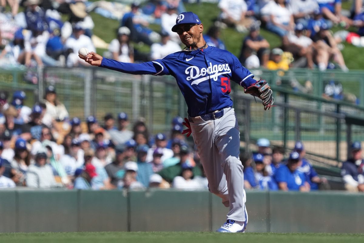 Mar 8, 2025; Phoenix, Arizona, USA; Los Angeles Dodgers shortstop Mookie Betts (50) makes the play for an out against the Chicago White Sox in the second inning at Camelback Ranch-Glendale. Mandatory Credit: Rick Scuteri-Imagn Images