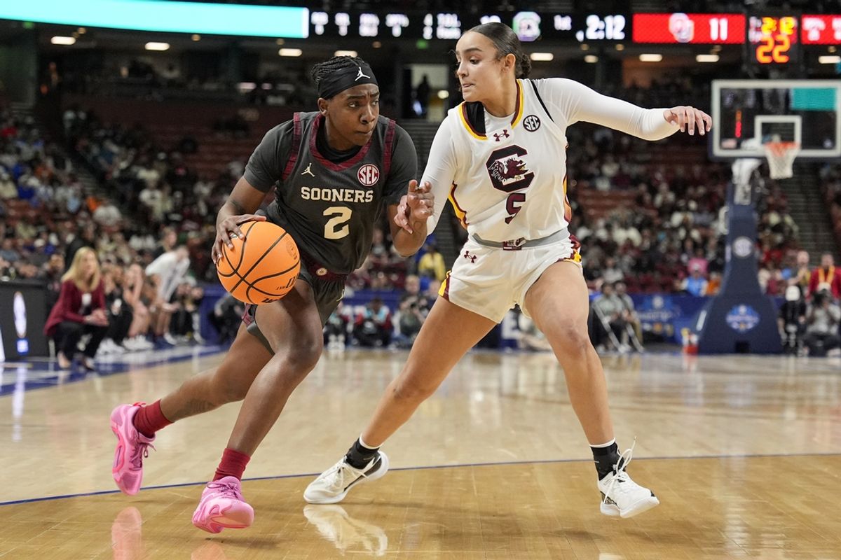 Mar 8, 2025; Greenville, SC, USA; Oklahoma Sooners guard Reyna Scott (2) drives to the basket defended by South Carolina Gamecocks guard Tessa Johnson (5) during the first half at Bon Secours Wellness Arena. Mandatory Credit: Jim Dedmon-Imagn Images