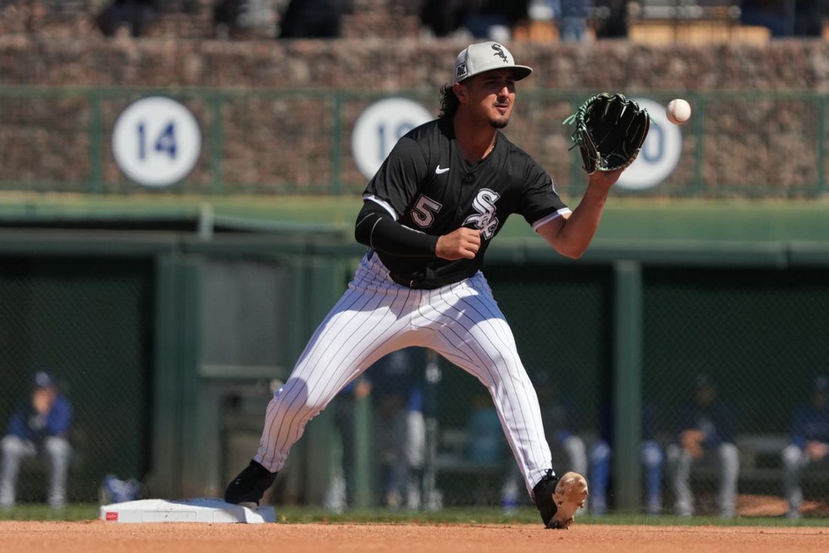 Mar 8, 2025; Phoenix, Arizona, USA; Chicago White Sox third base Josh Rojas (5) makes the play for an out against the Los Angeles Dodgers in the fourth inning at Camelback Ranch-Glendale. Mandatory Credit: Rick Scuteri-Imagn Images