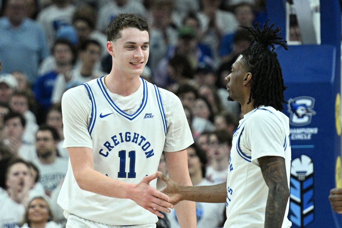 Mar 8, 2025; Omaha, Nebraska, USA; Creighton Bluejays center Ryan Kalkbrenner (11) greets guard Jamiya Neal (5) after scoring against the Butler Bulldogs during the first half at CHI Health Center Omaha. Mandatory Credit: Steven Branscombe-Imagn Images
