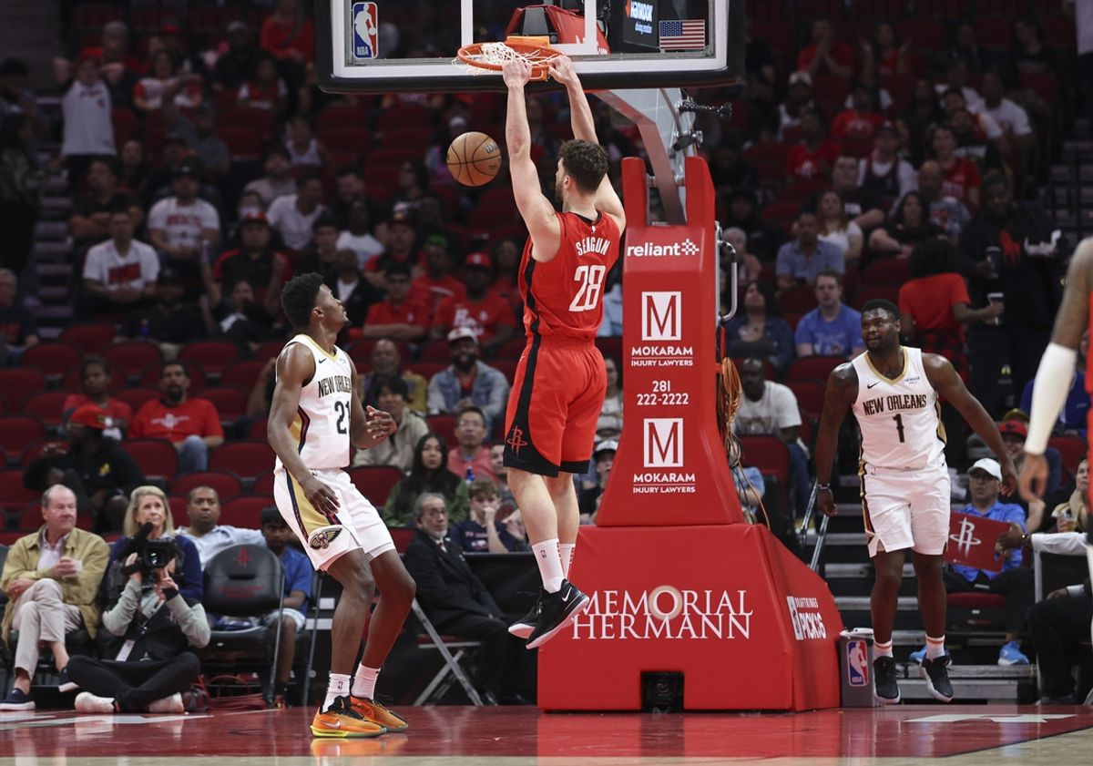Mar 8, 2025; Houston, Texas, USA;  Houston Rockets center Alperen Sengun (28) scores a basket during the first quarter against the New Orleans Pelicans at Toyota Center. Mandatory Credit: Troy Taormina-Imagn Images