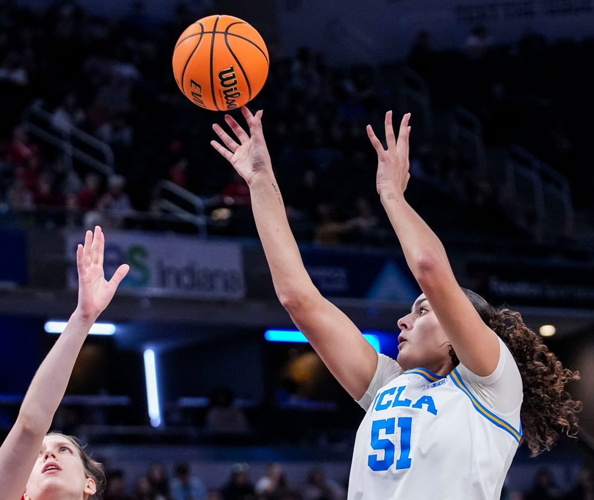 UCLA Bruins center Lauren Betts (51) goes up for a basket against Ohio State Buckeyes center Elsa Lemmilä (12) on Saturday, March 8, 2025, in a semifinals game at the 2025 TIAA Big Ten Women's Basketball Tournament between the UCLA Bruins and the Ohio State Buckeyes at Gainbridge Fieldhouse in Indianapolis.