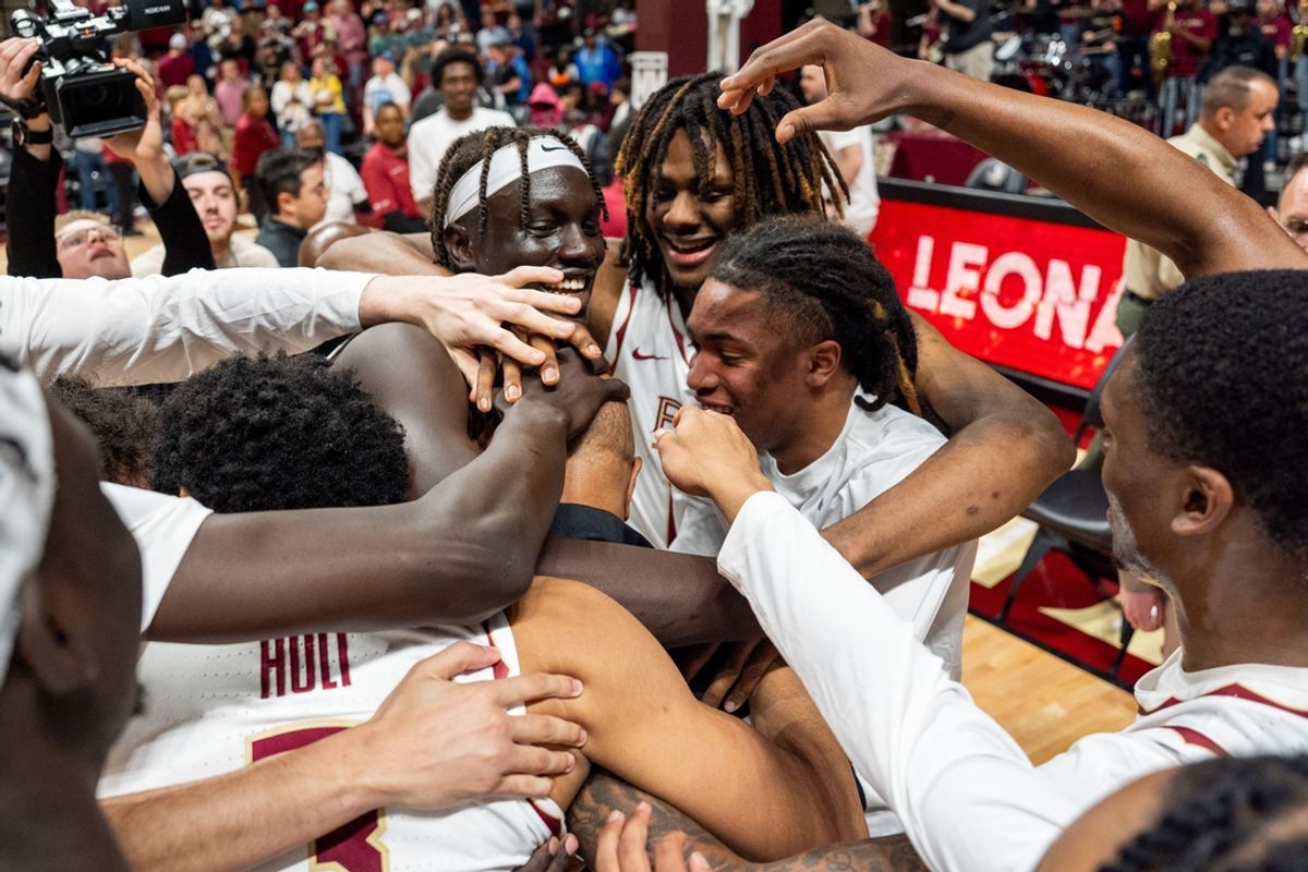 Players celebrate with Florida State Seminoles head coach Leonard Hamilton after winning his last home game as head coach and becoming the winningest coach in FSU history before retiring. The Florida State Seminoles defeated the Southern Methodist Mustangs 76-69 on Saturday, March 8, 2025.