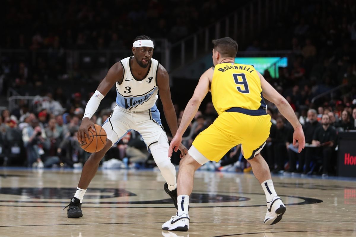 Mar 8, 2025; Atlanta, Georgia, USA; Atlanta Hawks guard Caris LeVert (3) dribbles defended by Indiana Pacers guard T.J. McConnell (9) during the first quarter at State Farm Arena. Mandatory Credit: Mady Mertens-Imagn Images