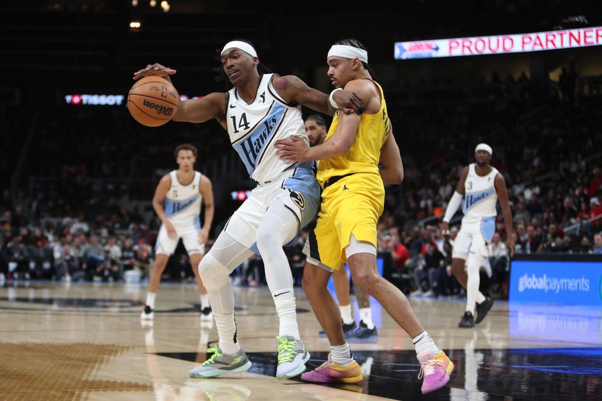 Mar 8, 2025; Atlanta, Georgia, USA; Atlanta Hawks guard Terance Mann (14) tries to work past Indiana Pacers guard Andrew Nembhard (2) during the first quarter at State Farm Arena. Mandatory Credit: Mady Mertens-Imagn Images