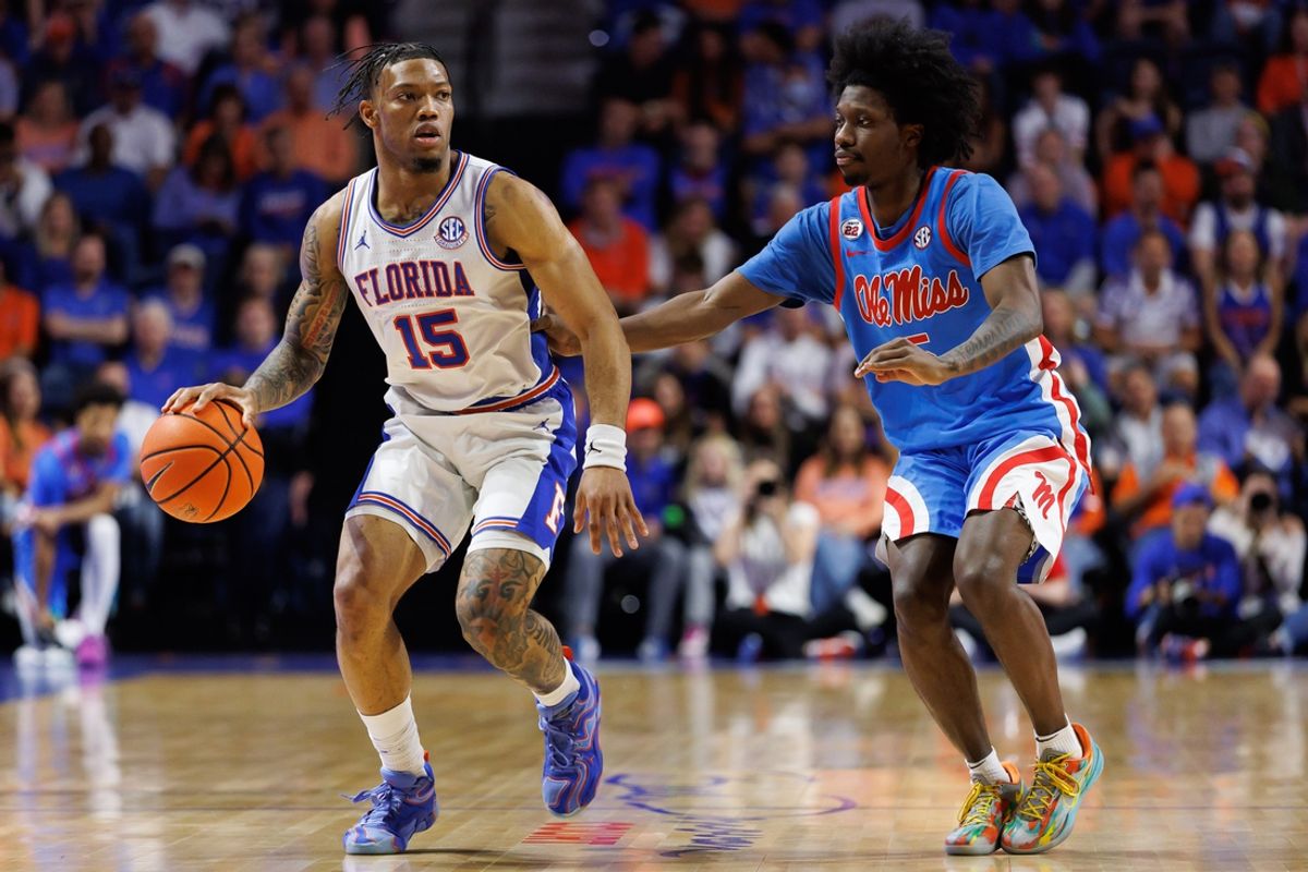 Mar 8, 2025; Gainesville, Florida, USA; Florida Gators guard Alijah Martin (15) dribbles the ball while Mississippi Rebels guard Jaylen Murray (5) defends during the second half at Exactech Arena at the Stephen C. O'Connell Center. Mandatory Credit: Matt Pendleton-Imagn Images