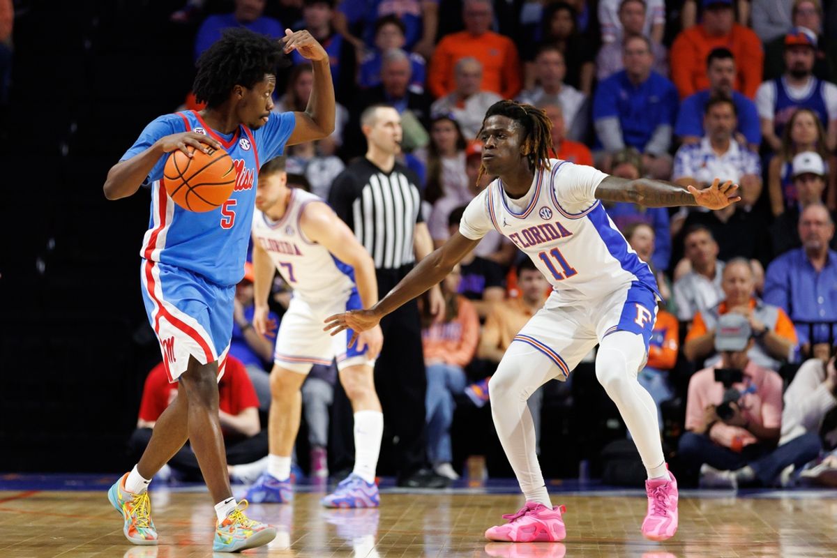 Mar 8, 2025; Gainesville, Florida, USA; Mississippi Rebels guard Jaylen Murray (5) gestures while Florida Gators guard Denzel Aberdeen (11) during the second half at Exactech Arena at the Stephen C. O'Connell Center. Mandatory Credit: Matt Pendleton-Imagn Images