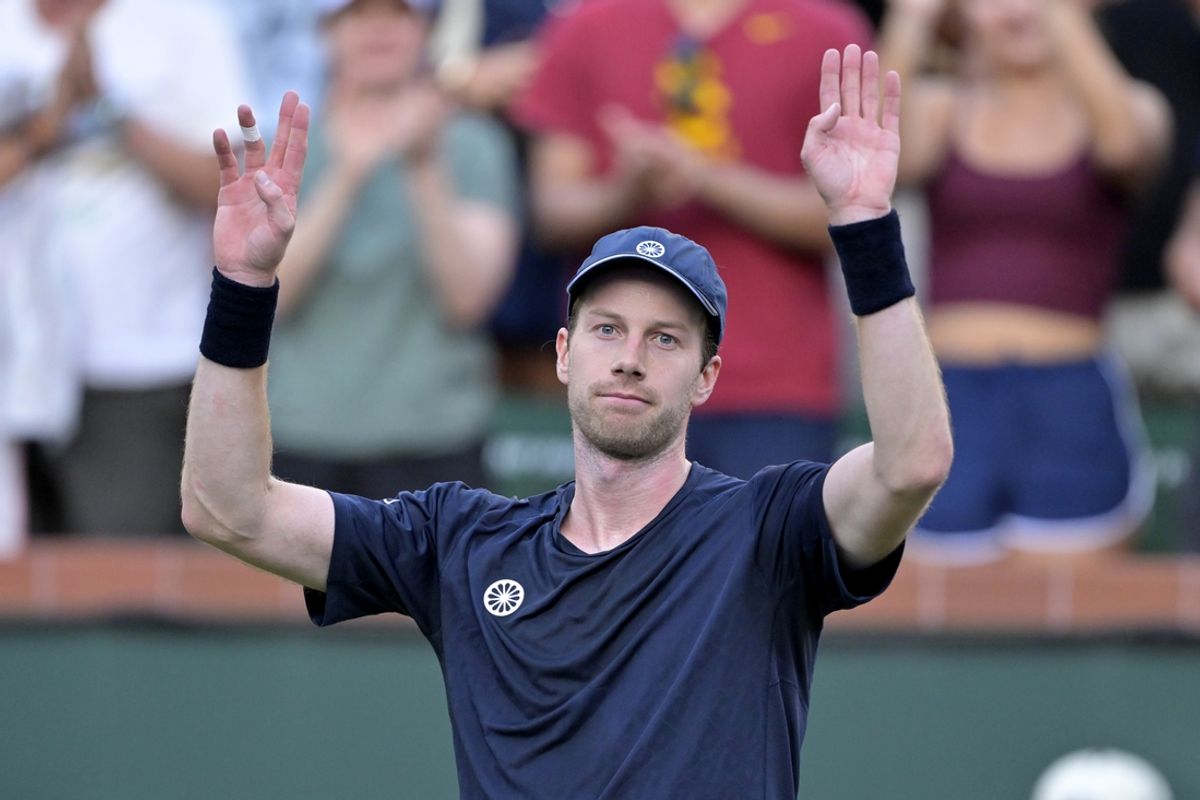Mar 8, 2025; Indian Wells, CA, USA;  Botic Van De Zandschulp (NED) acknowledges the crowd after defeating Novak Djokovic (not pictured) during the second round of the BNP Paribas Open at the Indian Well Tennis Garden. Mandatory Credit: Jayne Kamin-Oncea-Imagn Images