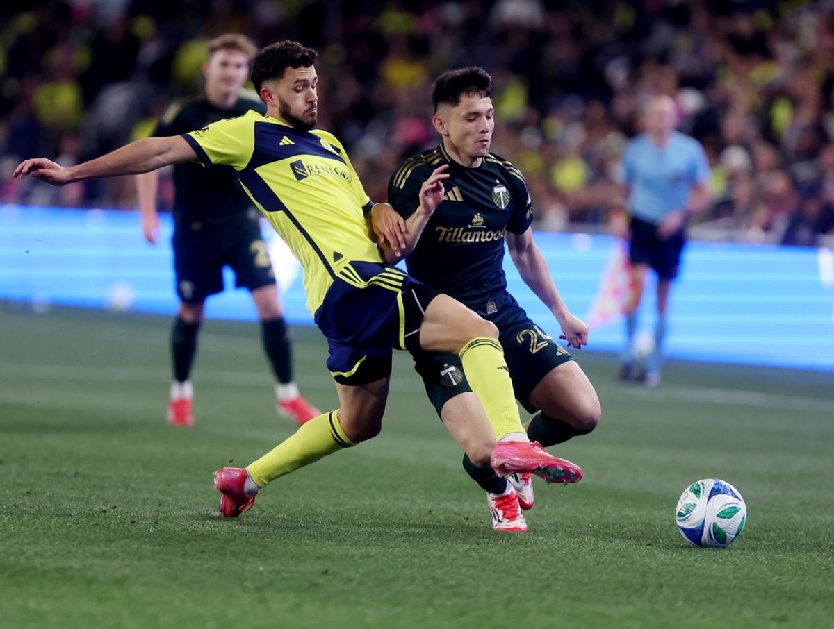 Mar 8, 2025; Nashville, Tennessee, USA; Nashville SC midfielder Patrick Yazbek (8) competes for the ball with Portland Timbers midfielder David Ayala (24) during the first half of their game at Geodis Park. Mandatory Credit: Alan Poizner-Imagn Images