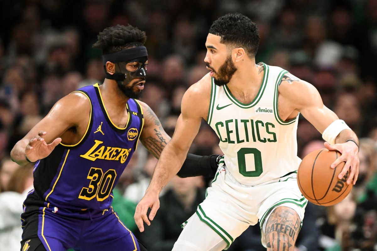 Mar 8, 2025; Boston, Massachusetts, USA; Boston Celtics forward Jayson Tatum (0) controls the ball against Los Angeles Lakers guard Jordan Goodwin (30) during the second quarter at the TD Garden. Mandatory Credit: Brian Fluharty-Imagn Images
