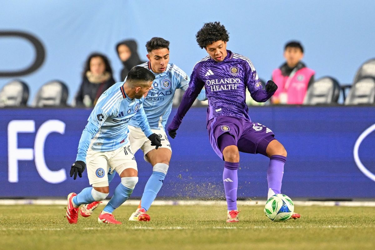 Mar 8, 2025; New York, New York, USA; Orlando City forward Gustavo Caraballo (65) controls the ball defended by New York City FC forward Agustín Ojeda (26) and midfielder Maximiliano Moralez (10) during the second half at Yankee Stadium. Mandatory Credit: Mark Smith-Imagn Images