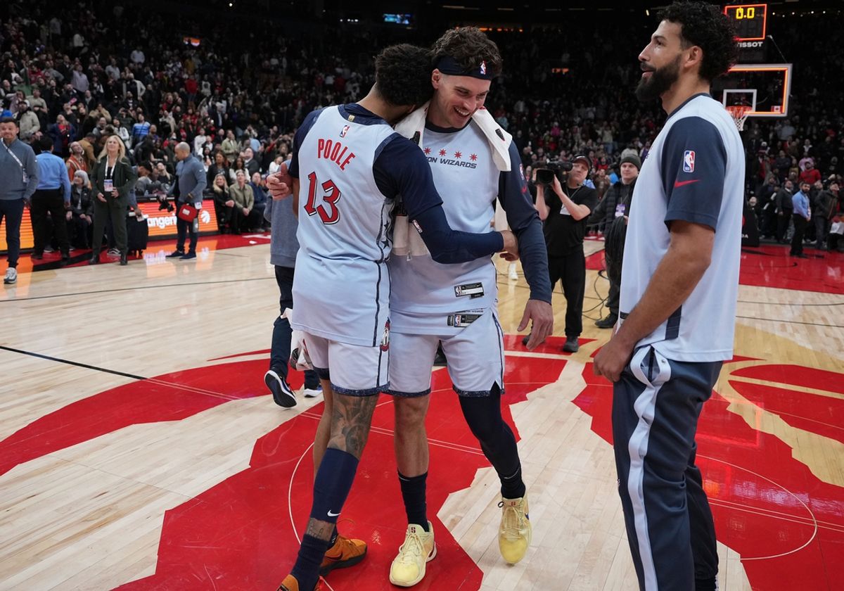Mar 8, 2025; Toronto, Ontario, CAN; Washington Wizards guard Jordan Poole (13) celebrates a win with forward Corey Kispert (24) against the Toronto Raptors at the end of the fourth quarter against the Toronto Raptors at Scotiabank Arena. Mandatory Credit: Nick Turchiaro-Imagn Images