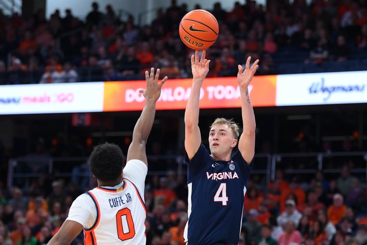 Mar 8, 2025; Syracuse, New York, USA; Virginia Cavaliers guard Andrew Rohde (4) shoots against Syracuse Orange guard Kyle Cuffe Jr. (0) during the second half at the JMA Wireless Dome. Mandatory Credit: Rich Barnes-Imagn Images