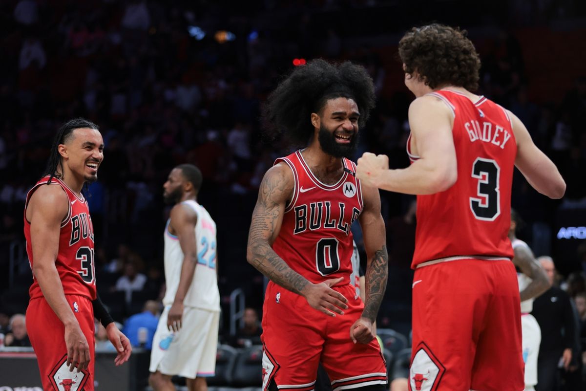 Mar 8, 2025; Miami, Florida, USA; Chicago Bulls guard Coby White (0) celebrates with guard Josh Giddey (3) after the game against the Miami Heat at Kaseya Center. Mandatory Credit: Sam Navarro-Imagn Images