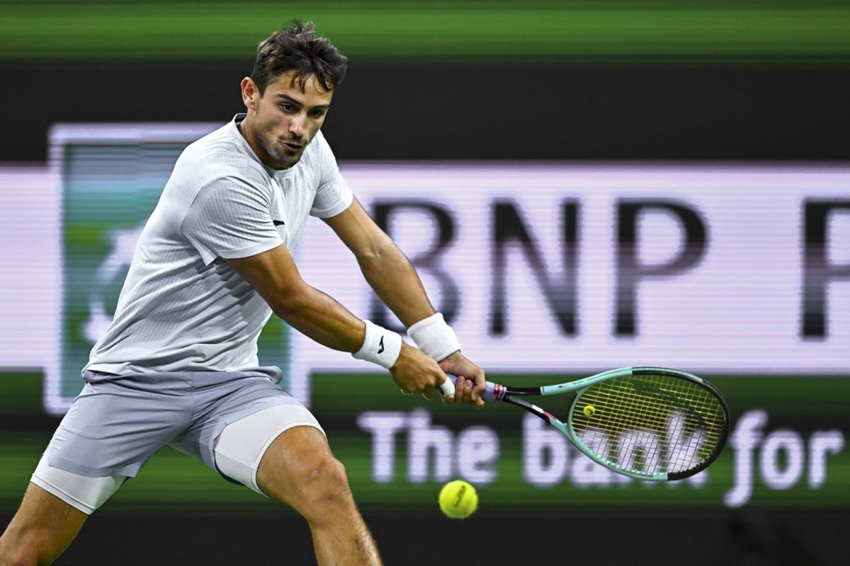 Mar 8, 2025; Indian Wells, CA, USA; Mariano Navone (ARG) hits a ball against Ben Shelton (USA) at Indian Well Tennis Garden. Mandatory Credit: Jonathan Hui-Imagn Images