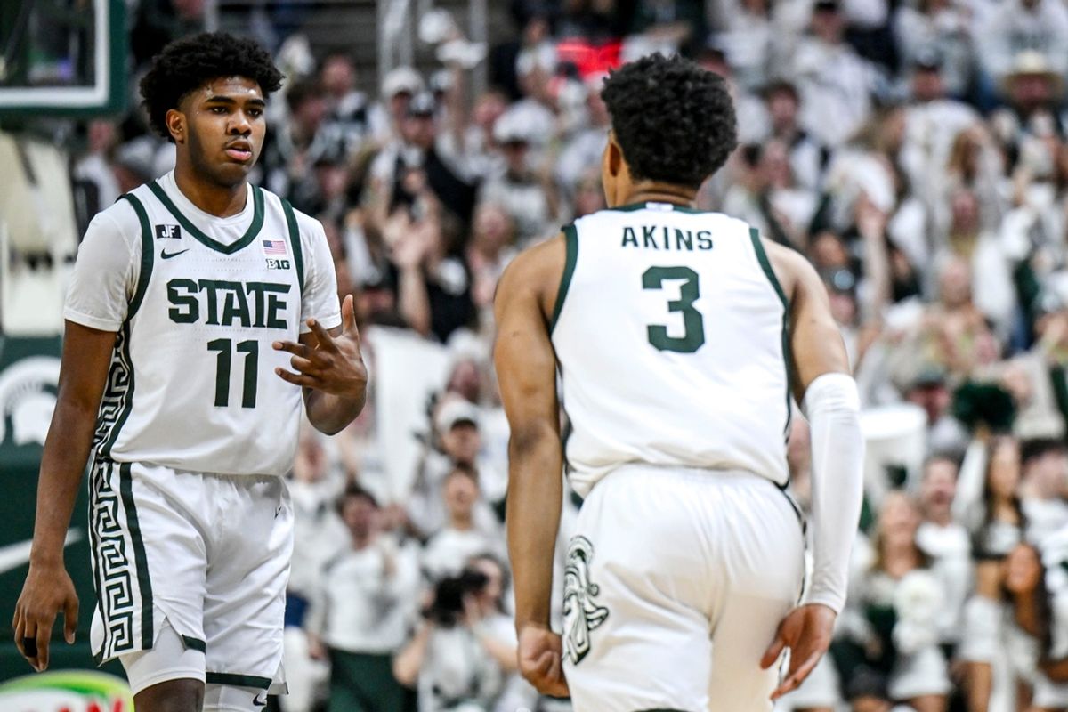 Michigan State's Jase Richardson, left, celebrates after Jaden Akins' 3-pointer against Michigan during the first half on Sunday, March 9, 2025, at the Breslin Center in East Lansing.
