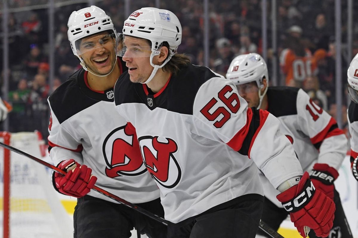 Mar 9, 2025; Philadelphia, Pennsylvania, USA; New Jersey Devils left wing Erik Haula (56) celebrates his goal with defenseman Johnathan Kovacevic (8) asf during the second period at Wells Fargo Center. Mandatory Credit: Eric Hartline-Imagn Images