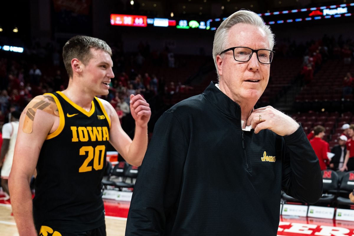 Mar 9, 2025; Lincoln, Nebraska, USA; Iowa Hawkeyes head coach Fran McCaffery and forward Payton Sandfort (20) walk off the court after defeating the Nebraska Cornhuskers at Pinnacle Bank Arena. Mandatory Credit: Dylan Widger-Imagn Images