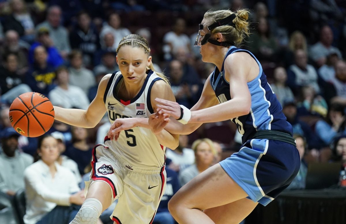 Mar 9, 2025; Uncasville, CT, USA; UConn Huskies guard Paige Bueckers (5) drives the ball against Villanova Wildcats guard Maddie Burke (23) in the first half at Mohegan Sun Arena. Mandatory Credit: David Butler II-Imagn Images