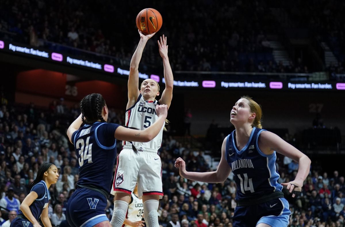 Mar 9, 2025; Uncasville, CT, USA; UConn Huskies guard Paige Bueckers (5) shoots the ball against Villanova Wildcats guard Maddie Webber (34) in the first half at Mohegan Sun Arena. Mandatory Credit: David Butler II-Imagn Images