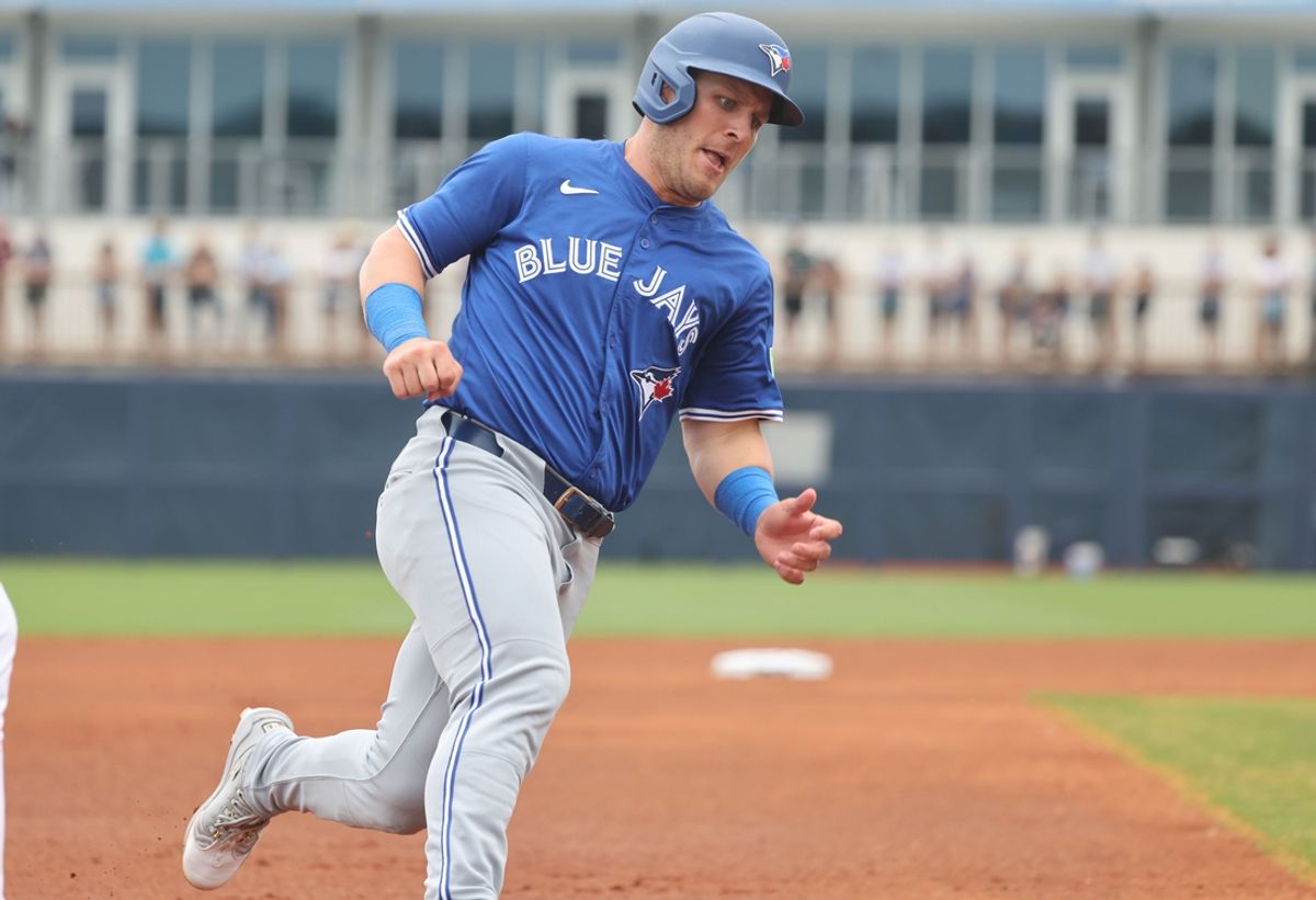 Mar 9, 2025; Port Charlotte, Florida, USA; Toronto Blue Jays outfielder Daulton Varsho (5) runs home to score a run during the first inning against the Tampa Bay Rays at Charlotte Sports Park. Mandatory Credit: Kim Klement Neitzel-Imagn Images