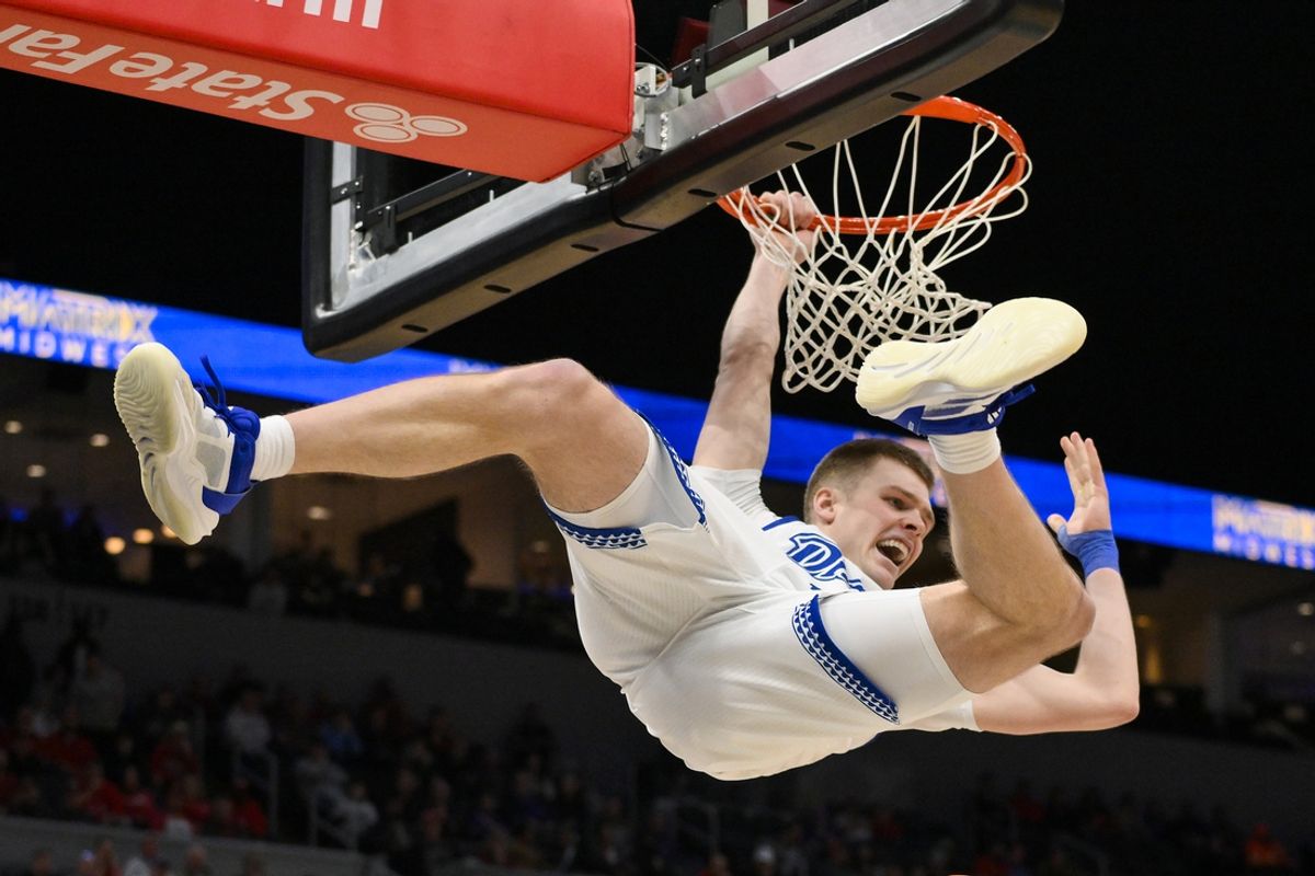 Drake Bulldogs guard Bennett Stirtz (14) dunks against the Bradley Braves  during the second half of the Missouri Valley Conference Tournament Championship at Enterprise Center. Mandatory Credit: Jeff Curry-Imagn Images