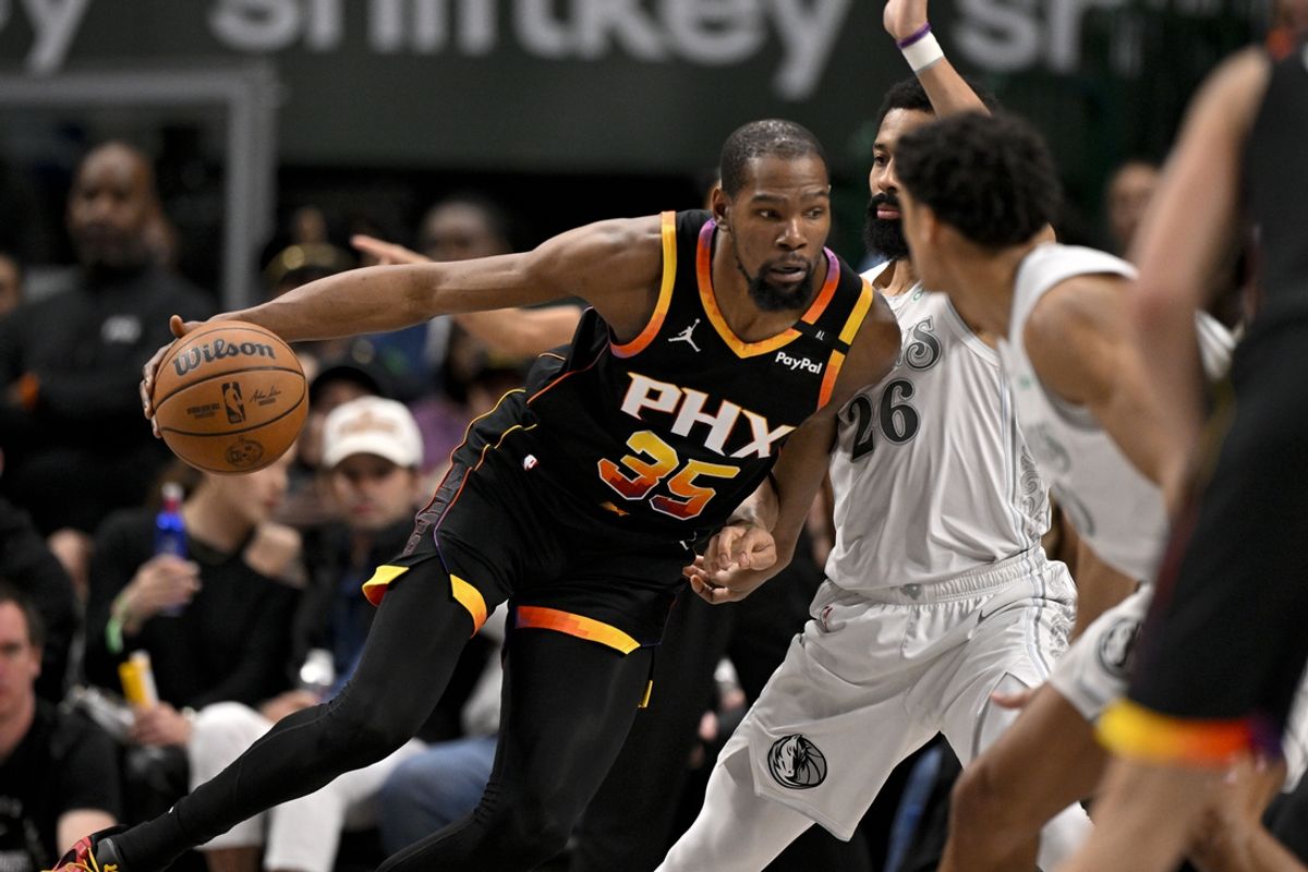 Mar 9, 2025; Dallas, Texas, USA; Phoenix Suns forward Kevin Durant (35) moves to the basket against Dallas Mavericks guard Spencer Dinwiddie (26) during the second half at the American Airlines Center. Mandatory Credit: Jerome Miron-Imagn Images