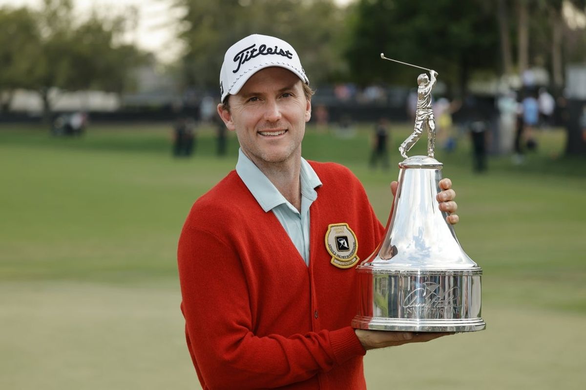 Mar 9, 2025; Orlando, Florida, USA;  Russell Henley holds the champions trophy after winning the Arnold Palmer Invitational golf tournament at Bay Hill. Mandatory Credit: Reinhold Matay-Imagn Images