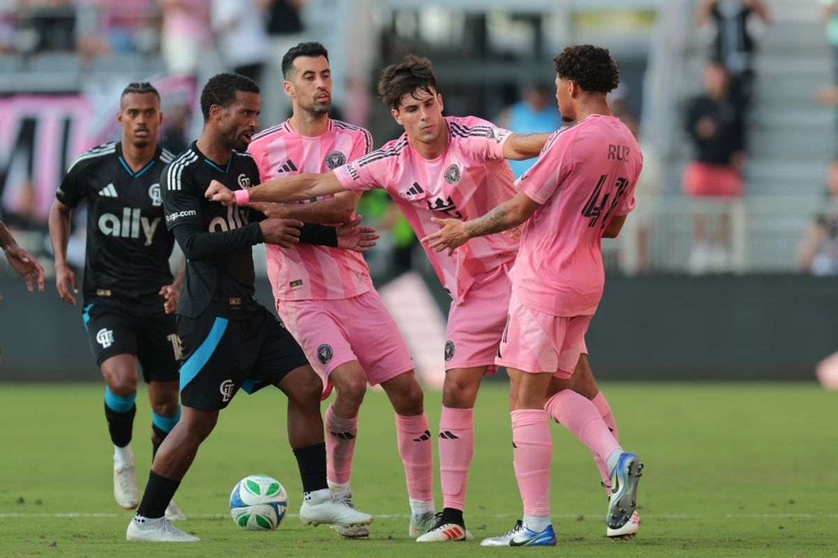 Mar 9, 2025; Fort Lauderdale, Florida, USA; Charlotte FC defender Nathan Byrne (14) argues with Inter Miami CF midfielder David Ruiz (41) as midfielder Federico Redondo (55) gets in between them after the game at Chase Stadium. Mandatory Credit: Sam Navarro-Imagn Images