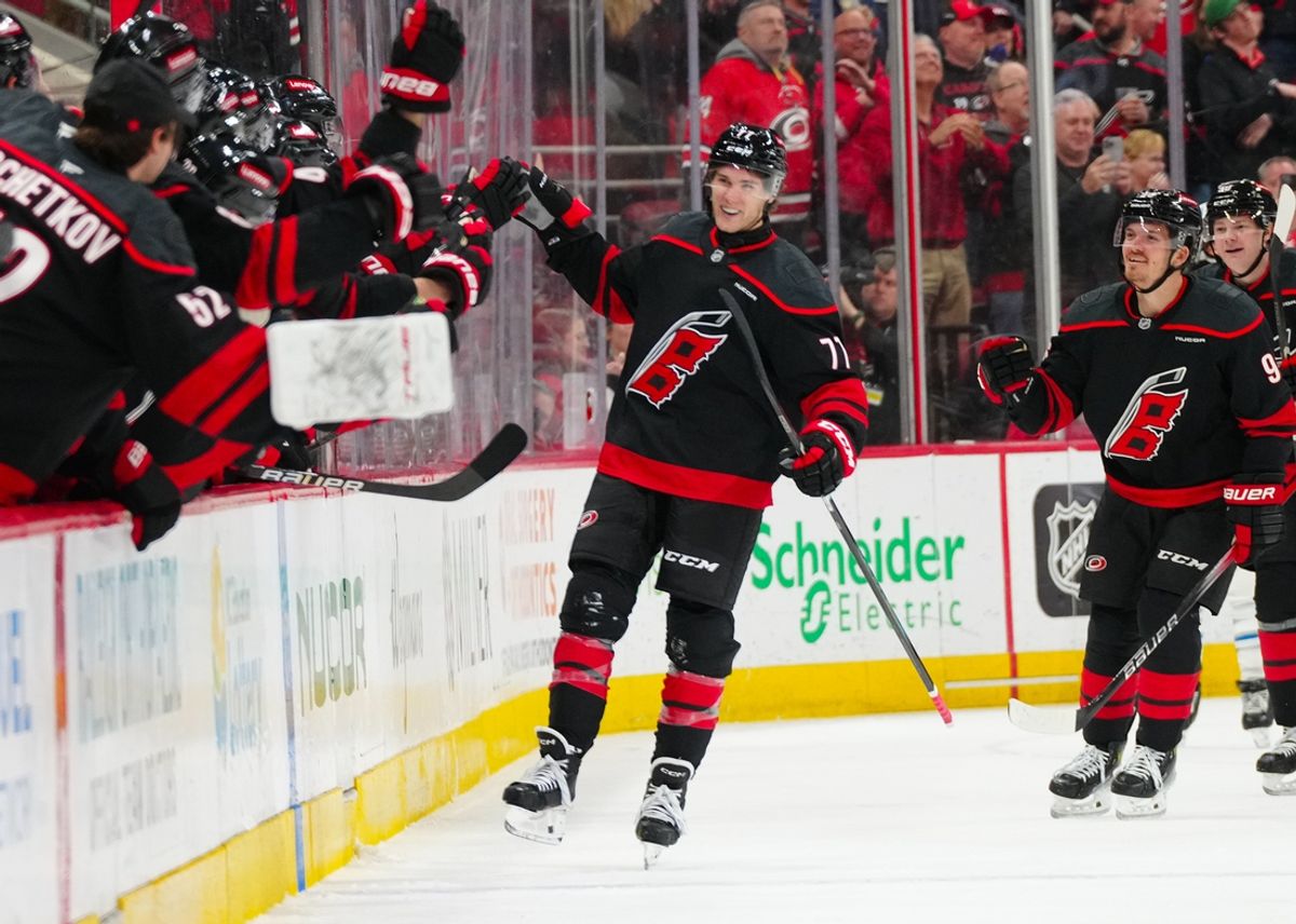 Mar 9, 2025; Raleigh, North Carolina, USA;  Carolina Hurricanes center Mark Jankowski (77) celebrates his goal against the Winnipeg Jets during the second period at Lenovo Center. Mandatory Credit: James Guillory-Imagn Images