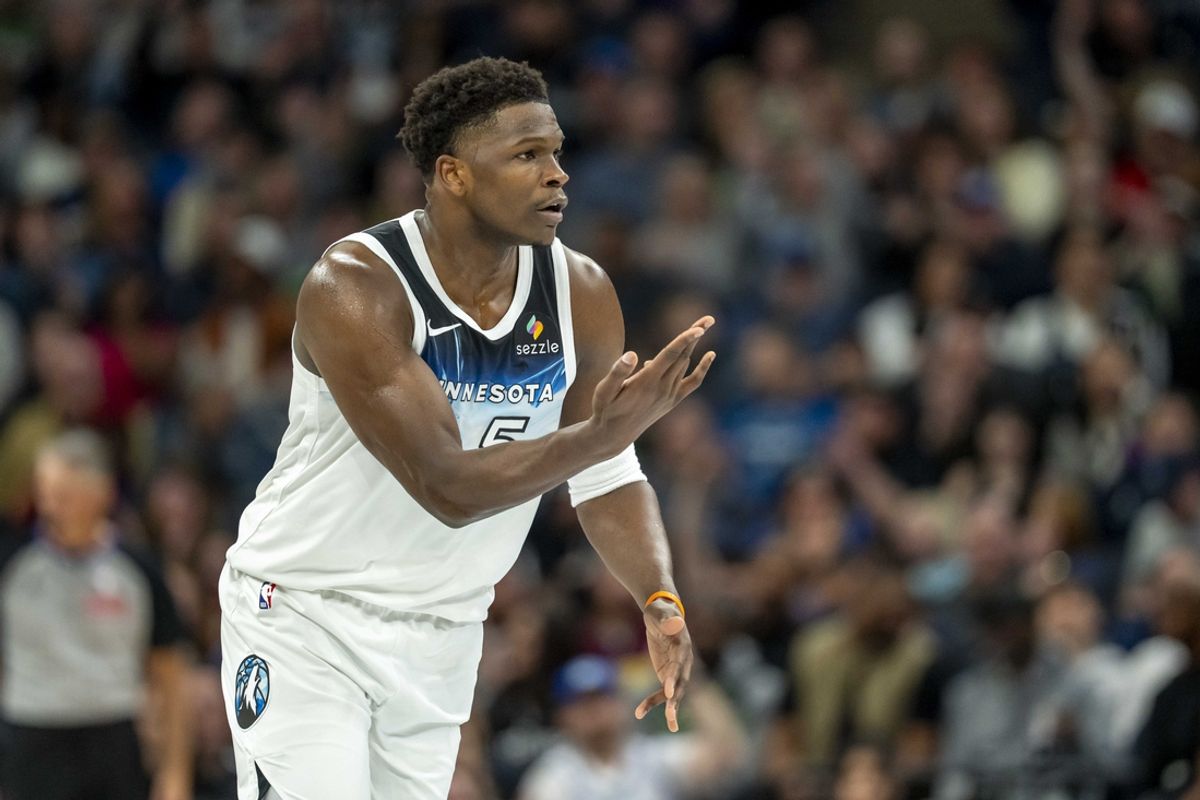 Mar 9, 2025; Minneapolis, Minnesota, USA; Minnesota Timberwolves guard Anthony Edwards (5) holds his hand up celebrating making a three point shot against the San Antonio Spurs in the first half at Target Center. Mandatory Credit: Jesse Johnson-Imagn Images