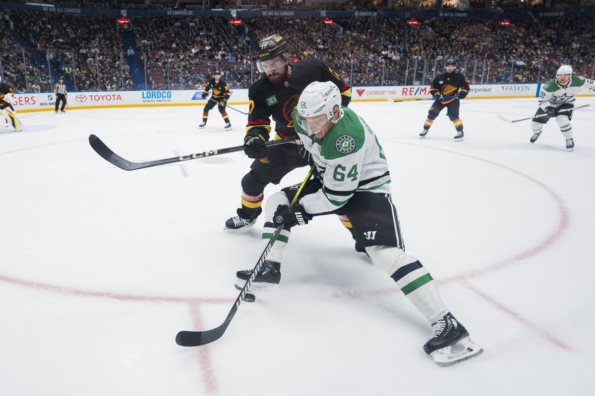 Mar 9, 2025; Vancouver, British Columbia, CAN; Vancouver Canucks defenseman Filip Hronek (17) checks Dallas Stars forward Mikael Granlund (64) in the first period at Rogers Arena. Mandatory Credit: Bob Frid-Imagn Images