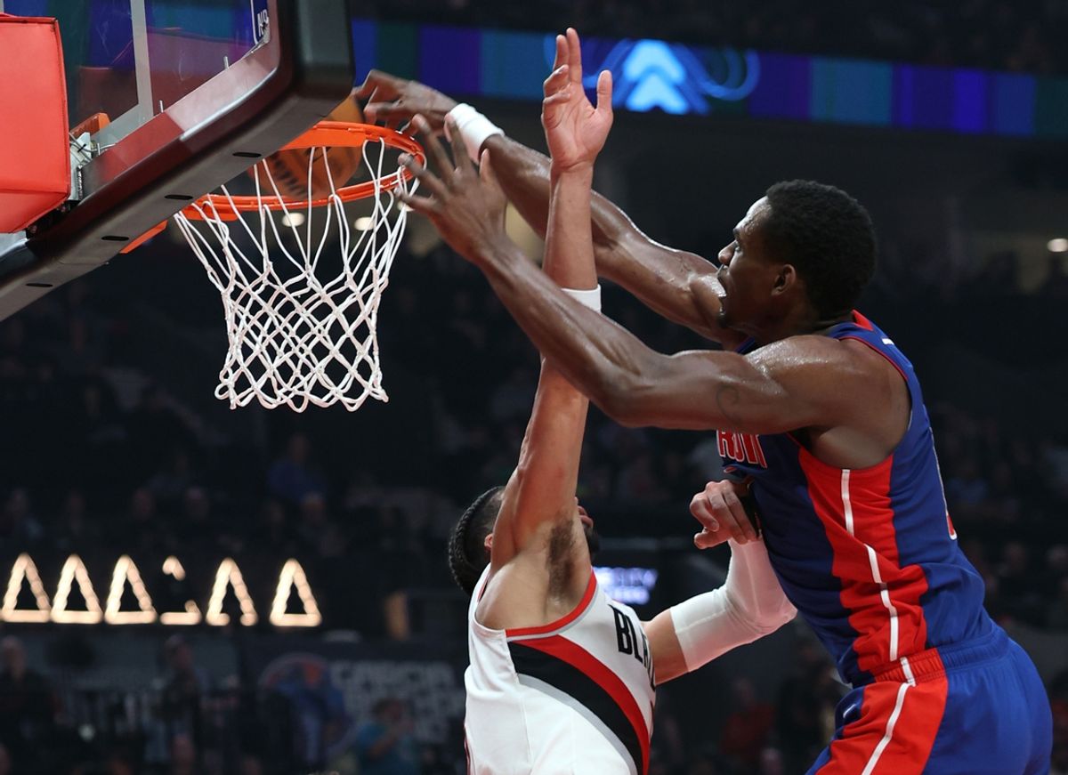 Mar 9, 2025; Portland, Oregon, USA;  Detroit Pistons center Jalen Duren (0) dunks over Portland Trail Blazers forward Toumani Camara (33) in the second half at Moda Center. Mandatory Credit: Jaime Valdez-Imagn Images