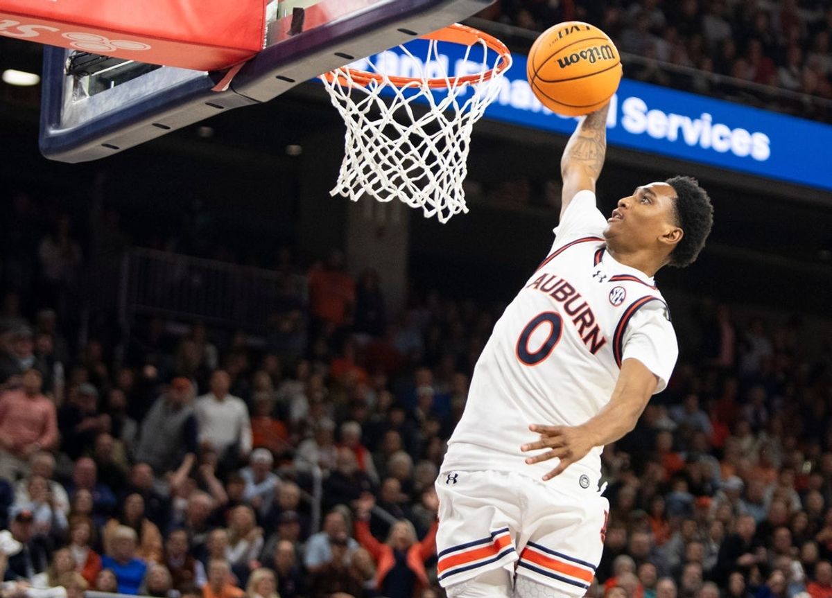 Auburn Tigers guard Tahaad Pettiford (0) dunks the ball as Auburn Tigers take on Mississippi State Bulldogs at Neville Arena in Auburn, Ala., on Tuesday, Jan. 14, 2025. Auburn Tigers defeated Mississippi State Bulldogs 88-66.
