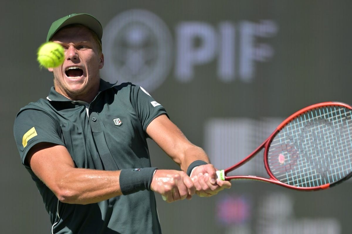 Mar 9, 2025; Indian Wells, CA, USA;  Jenson Brooksby (USA) hits a shot against Jack Draper (not pictured) during the BNP Paribas Open at the Indian Well Tennis Garden. Mandatory Credit: Jayne Kamin-Oncea-Imagn Images