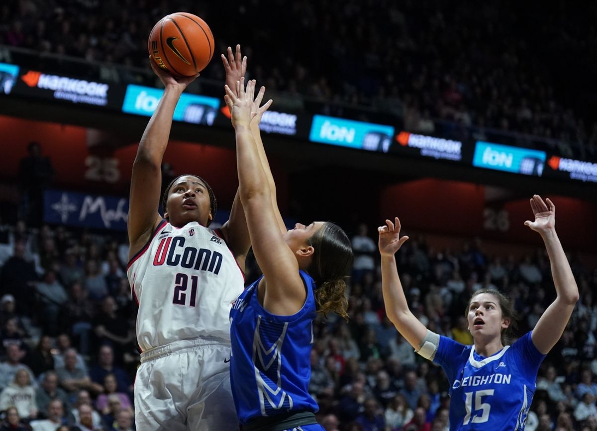 Mar 10, 2025; Uncasville, CT, USA; UConn Huskies forward Sarah Strong (21) shoots against Creighton Bluejays guard Kennedy Townsend (2) in the first half at Mohegan Sun Arena. Mandatory Credit: David Butler II-Imagn Images