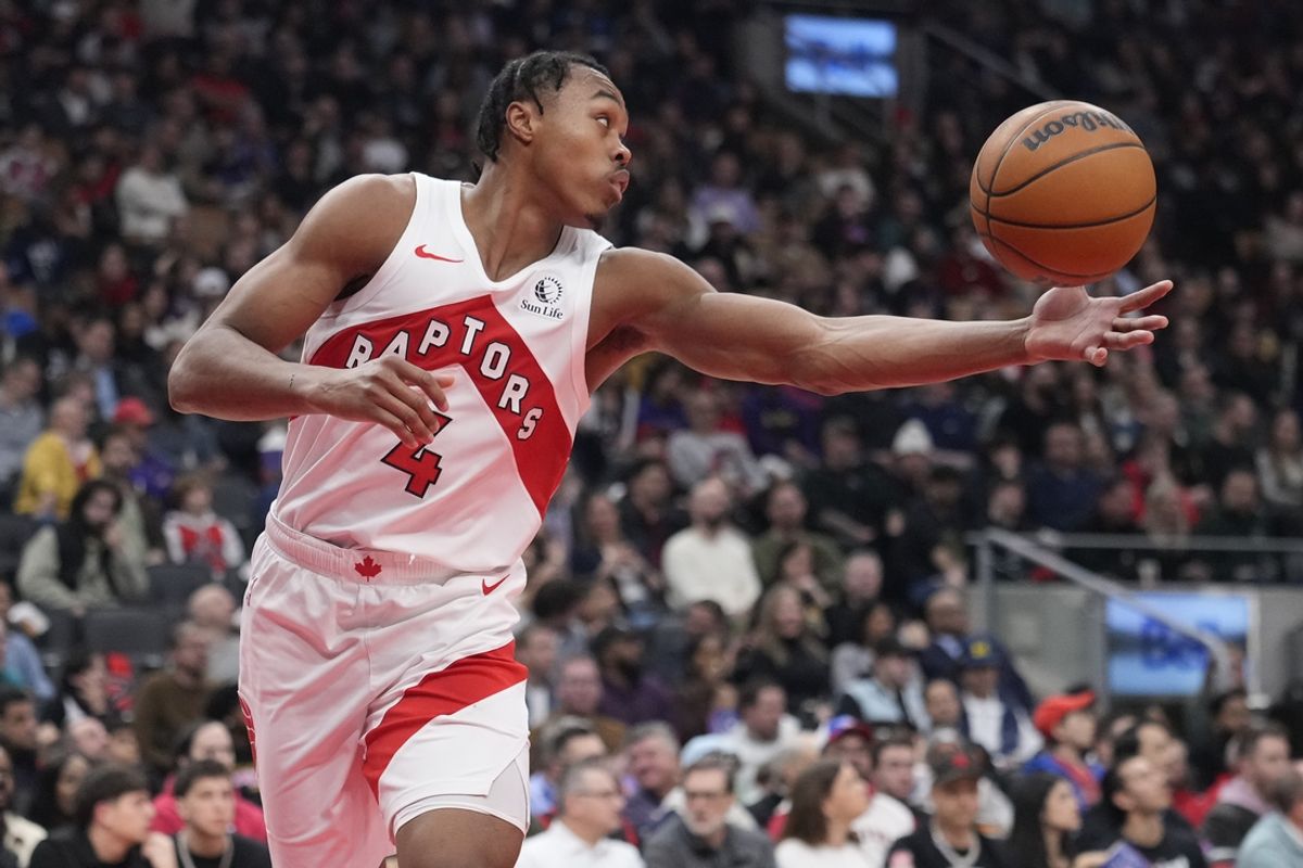 Mar 10, 2025; Toronto, Ontario, CAN; Toronto Raptors guard Scottie Barnes (4) reaches for a ball against the Washington Wizards during the first half at Scotiabank Arena. Mandatory Credit: John E. Sokolowski-Imagn Images