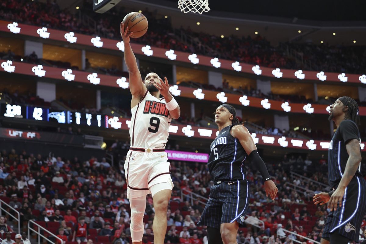 Mar 10, 2025; Houston, Texas, USA; Houston Rockets forward Dillon Brooks (9) shoots the ball as Orlando Magic forward Paolo Banchero (5) defends during the second quarter at Toyota Center. Mandatory Credit: Troy Taormina-Imagn Images
