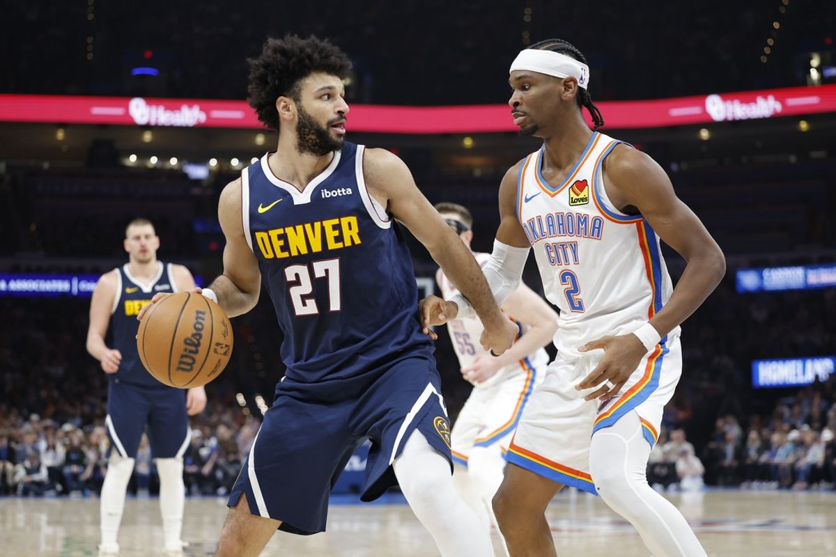 Mar 10, 2025; Oklahoma City, Oklahoma, USA;Denver Nuggets guard Jamal Murray (27) drives against Oklahoma City Thunder guard Shai Gilgeous-Alexander (2) during the second quarter at Paycom Center. Mandatory Credit: Alonzo Adams-Imagn Images