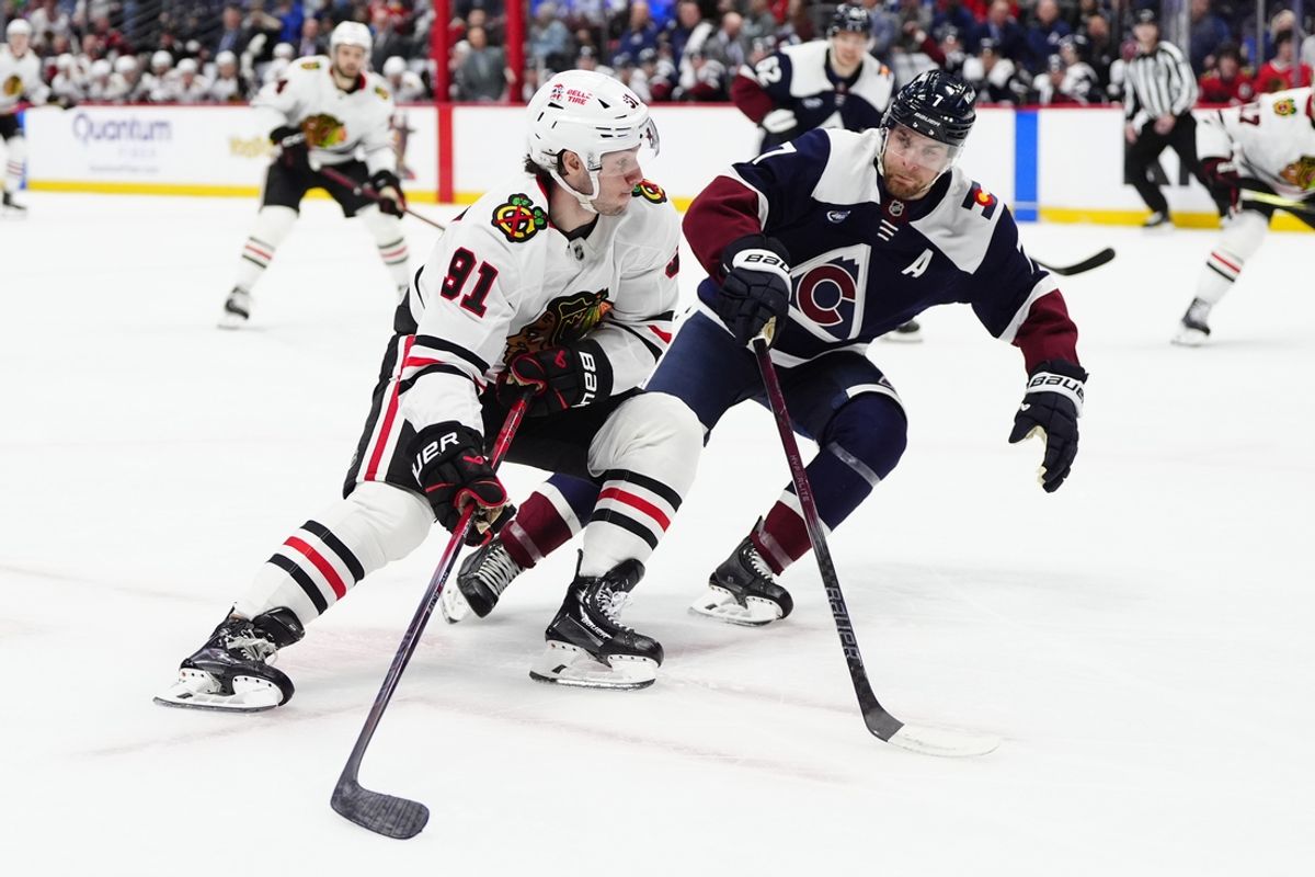 Mar 10, 2025; Denver, Colorado, USA; Colorado Avalanche defenseman Devon Toews (7) defends on Chicago Blackhawks center Frank Nazar (91) in the first period at Ball Arena. Mandatory Credit: Ron Chenoy-Imagn Images